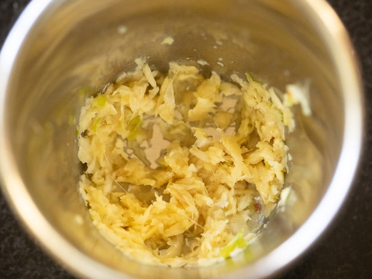 ginger and garlic crushed in a mortar-pestle