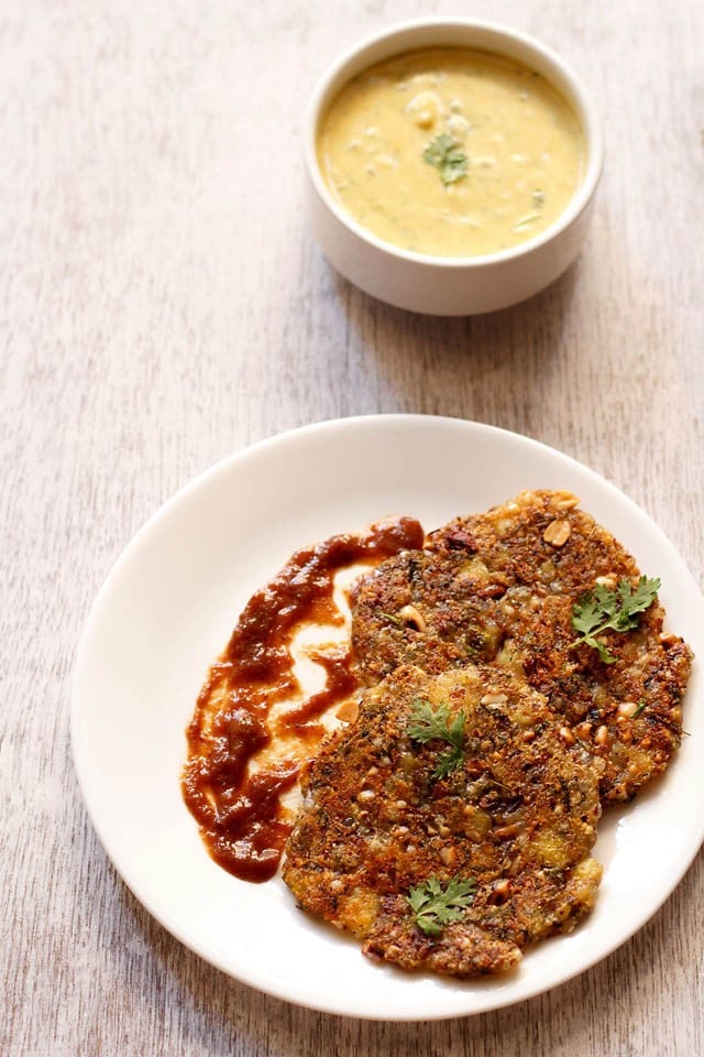 sabudana thalipeeth served on a white plate.