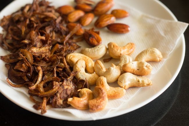 fried cashews draining on paper towels