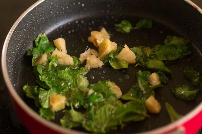 mint leaves curry leaves and ginger added to oil