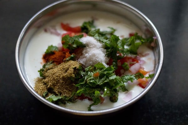 adding roasted cumin powder, red chili powder and salt