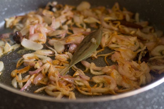 sauteing onions for palak biryani