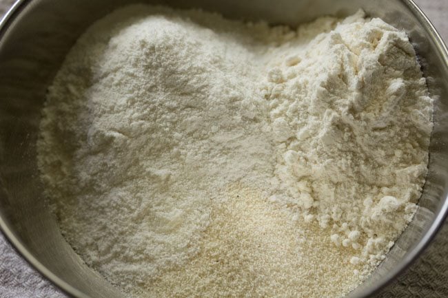 rava, rice flour and all-purpose flour in a steel mixing bowl