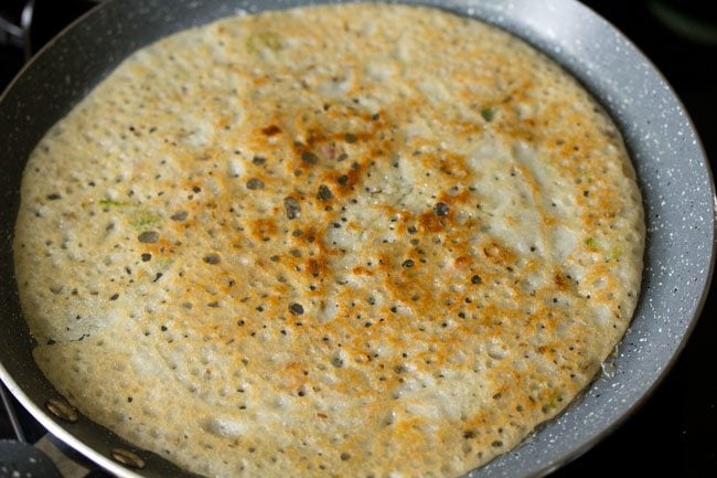 rava dosa or suji ka dosa flipped over