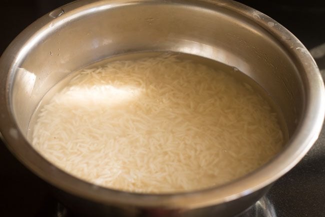 soaking rice in a steel container