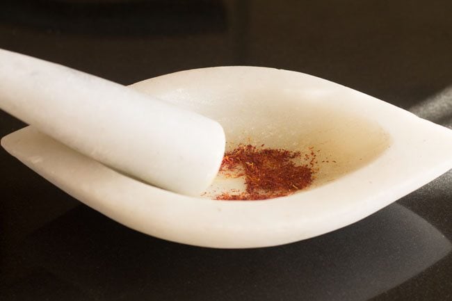 saffron crushed in a mortar-pestle