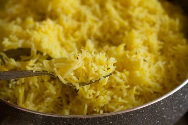 yellow rice fluffed with fork