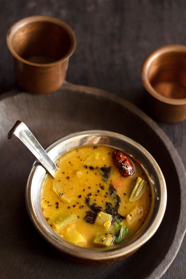udupi sambar in a bowl with spoon 