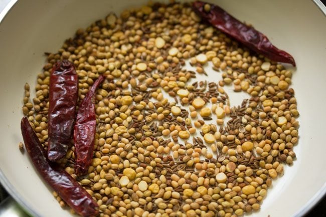 dry roasting spices in pan for udupi sambar powder 