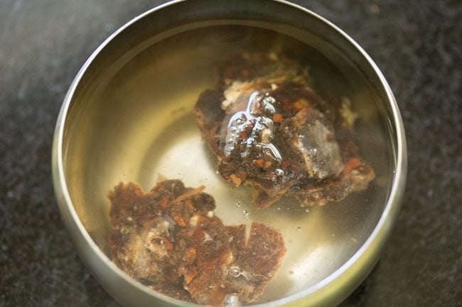 soaking tamarind in hot water for udupi sambar 