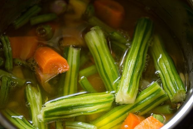 adding water to pan for udupi sambar 