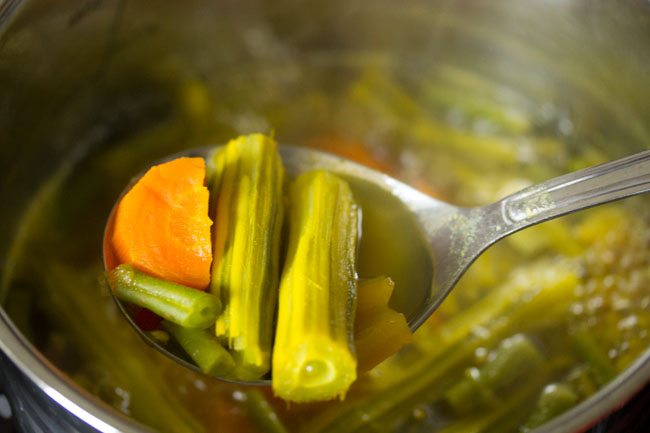 cooking the vegetables in pan for udupi sambar 