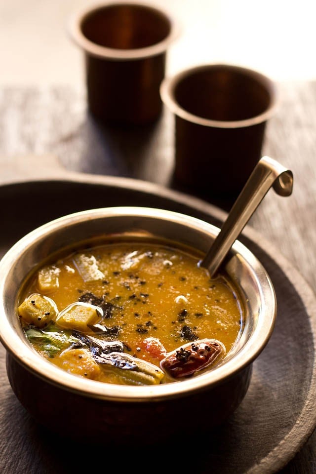 udupi sambar served in a bowl with a spoon 