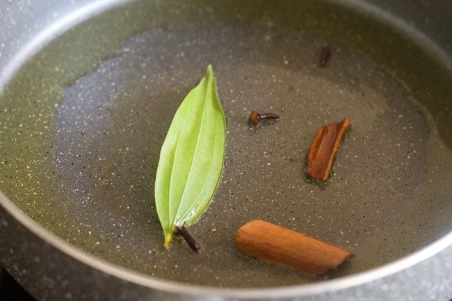 whole spices in pan