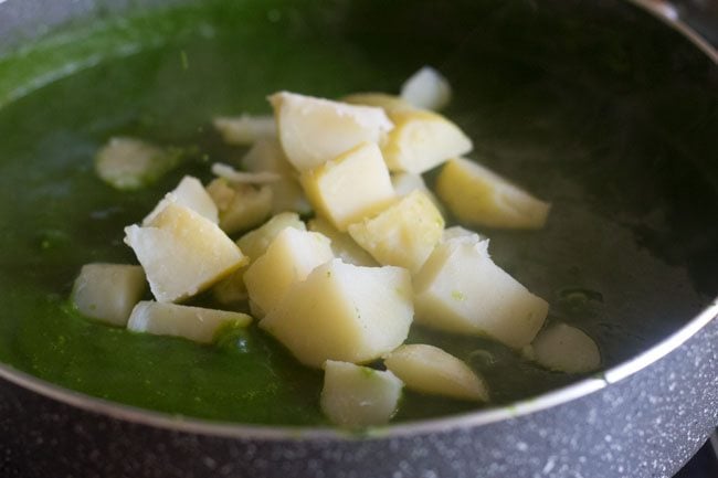 diced boiled potatoes added to spinach sauce