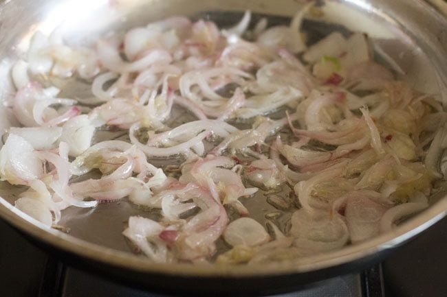 sautéing ginger-garlic paste till raw aroma goes away 