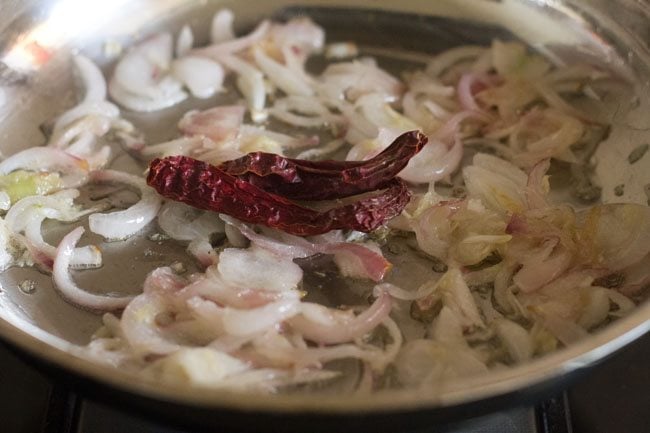 sautéing dried red chilies in pan