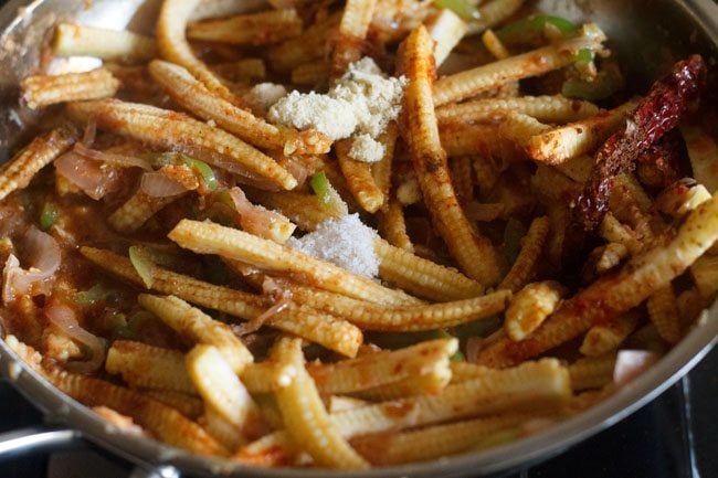 adding sugar and salt in pan