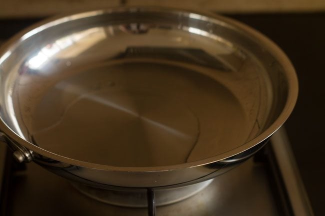 heating coconut oil in a pan