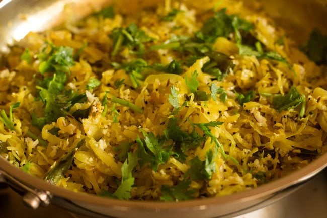 garnishing cabbage thoran with coriander leaves 