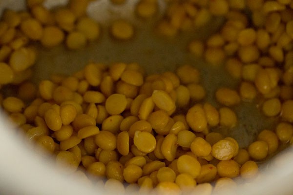 mixing chana dal with spices