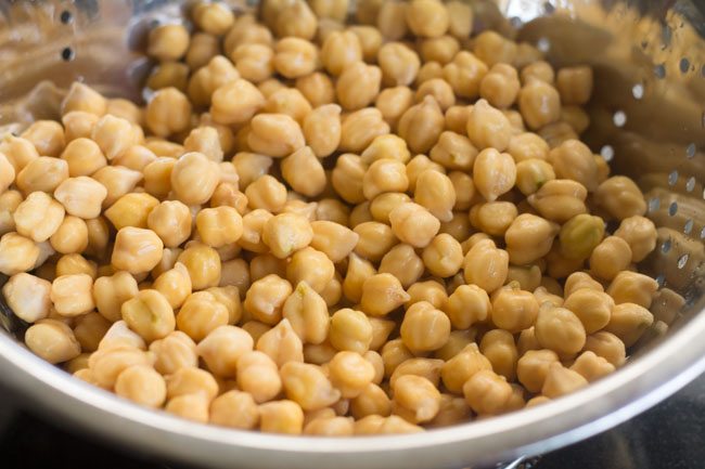 drained and soaked chickpeas in a colander