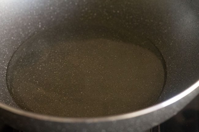 heating oil in a wok or pan