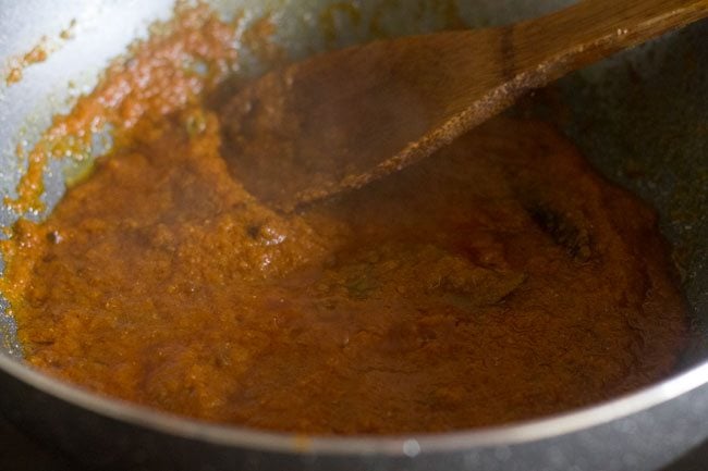 mixing spice powders with the paste