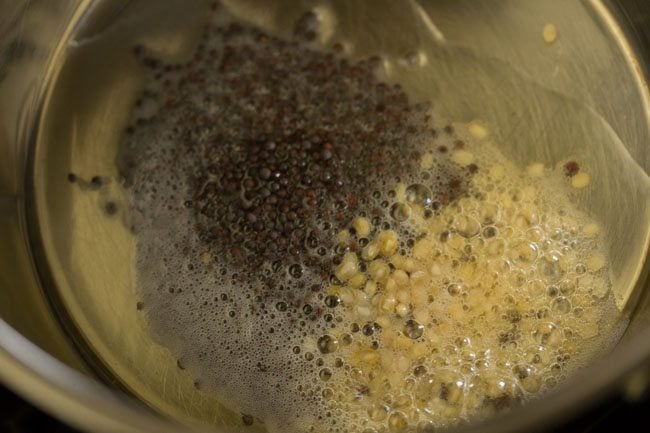 mustard seeds and urad dal in a pan