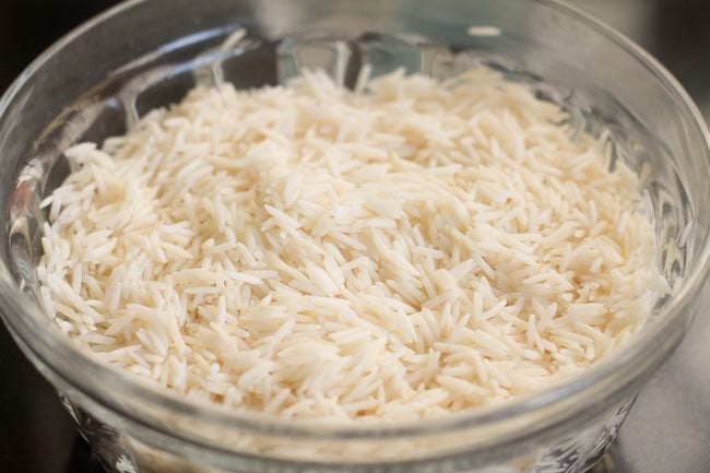 draining water from basmati rice 