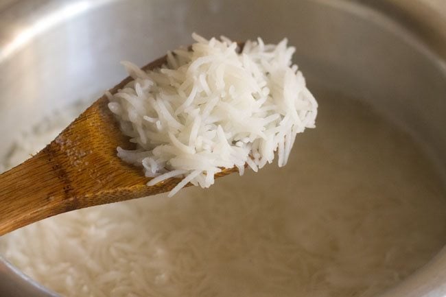 cooking the rice grains till 75% done 