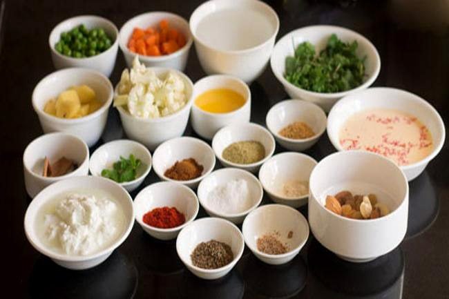 keeping ingredients ready for the vegetable gravy for kashmiri biryani 