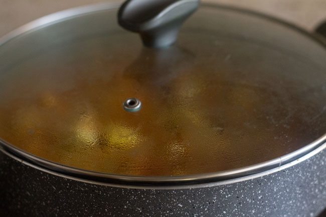 covering the pan with a lid