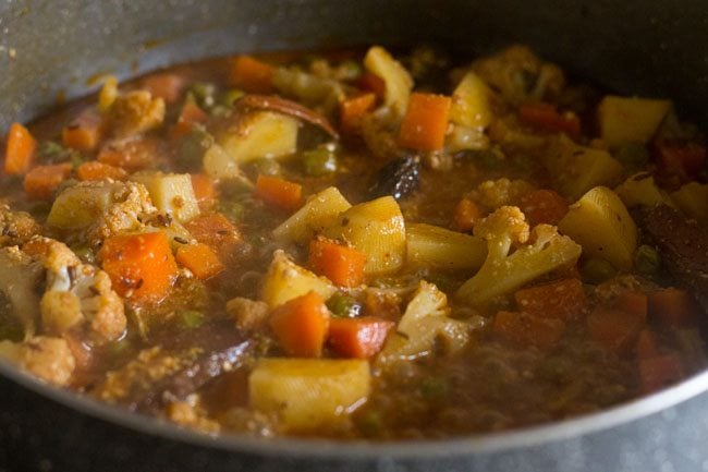 cooking the vegetable gravy till done 