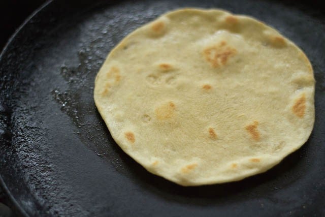 cooking one side of the kulcha 