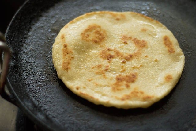 cooking kulcha till evenly done 