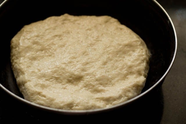 covering the kulcha dough in the bowl