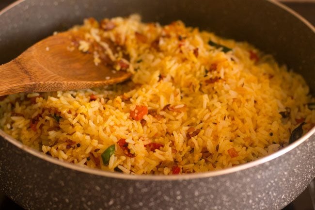 cooking masala rice in the pan