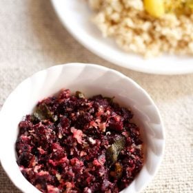 Beetroot porridge in a white bowl.