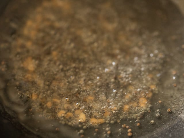 frying urad dal till it turns golden. 