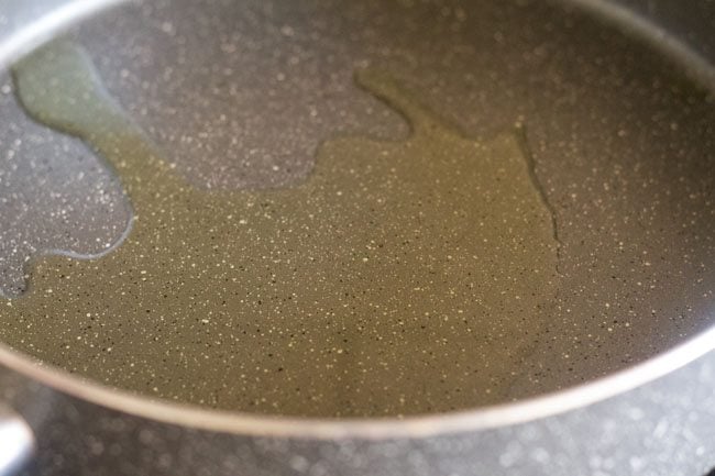 heating olive oil in a pan