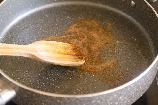 stirring spice powder in the pan