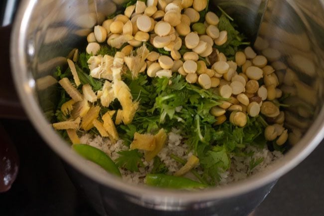roasted chana dal, chopped ginger and chopped green chili added to blender jar for making coriander coconut chutney. 