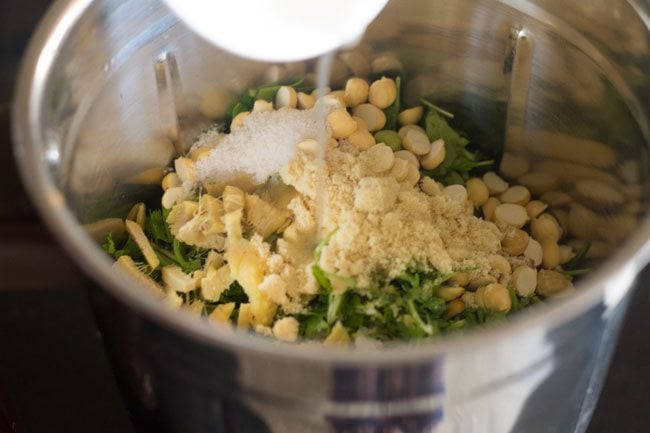 lemon juice, sugar and salt added to blender jar for making coriander coconut chutney. 