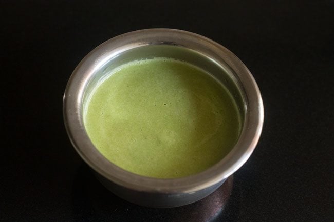 blended coriander coconut chutney added in a bowl. 