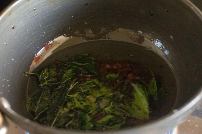 Fry curry leaves in hot oil. 