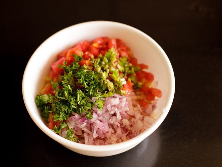 finely chopped green chili and coriander leaves added to the bowl. 