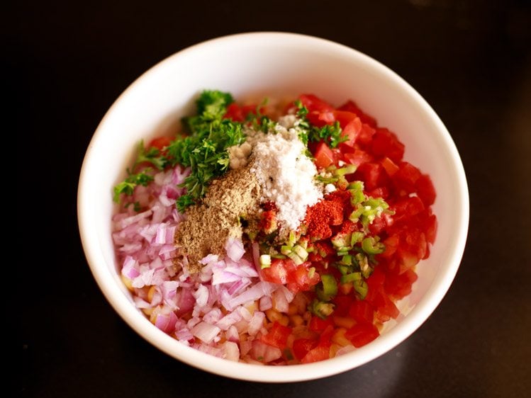 red chili powder, chaat masala powder and salt added to the bowl. 