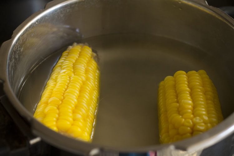 corn cooking in a pressure cooker