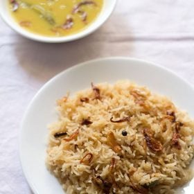 parsi brown rice served on a white plate with dal in a bowl kept on the top side and text layovers.